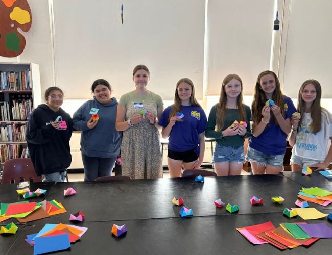 Abby teaching how to make fidgets